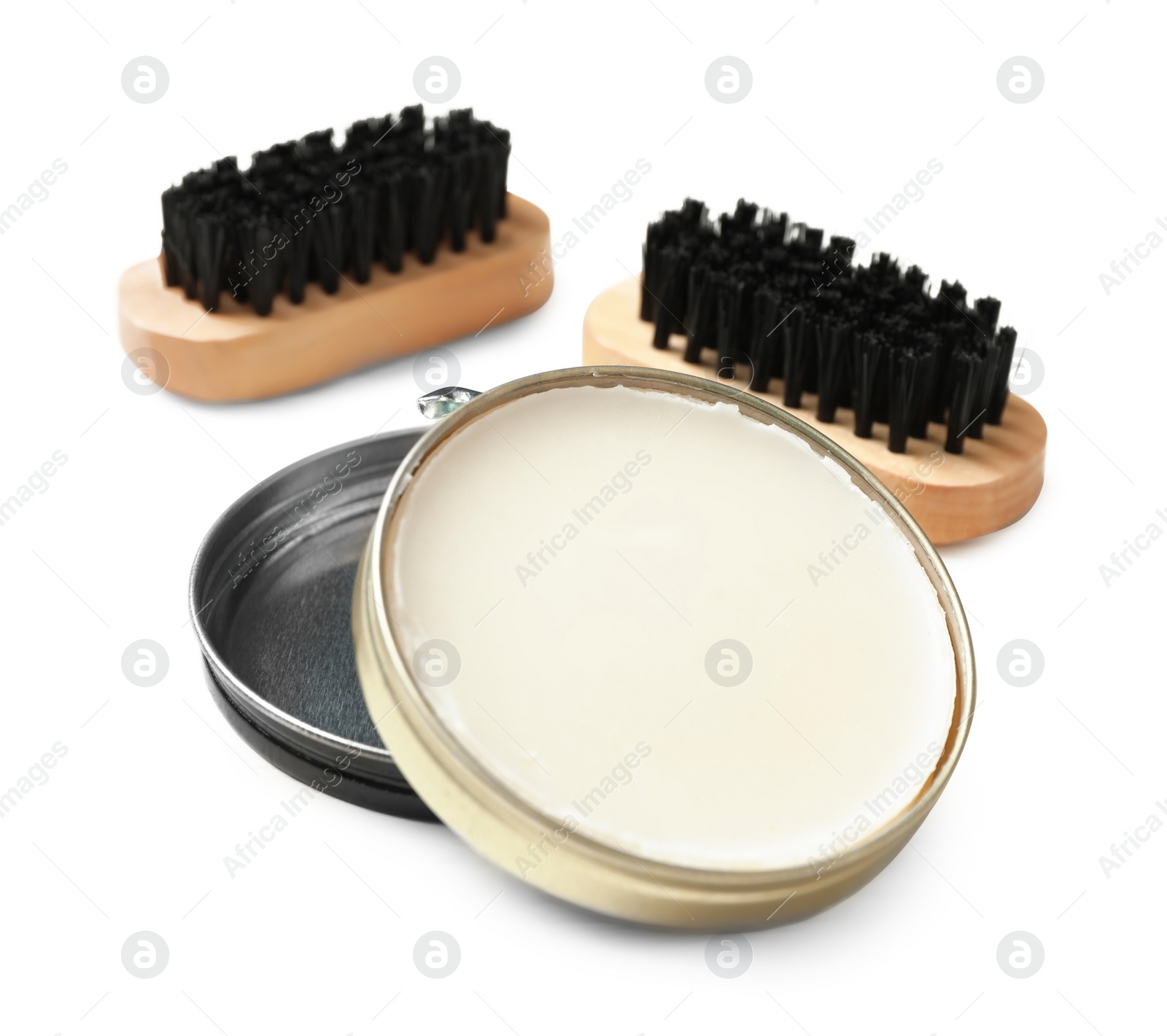 Photo of Shoe care accessories on white wooden background, closeup
