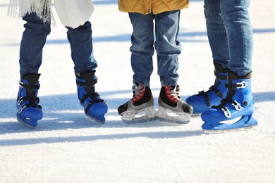 Photo of Family at outdoor ice skating rink, closeup