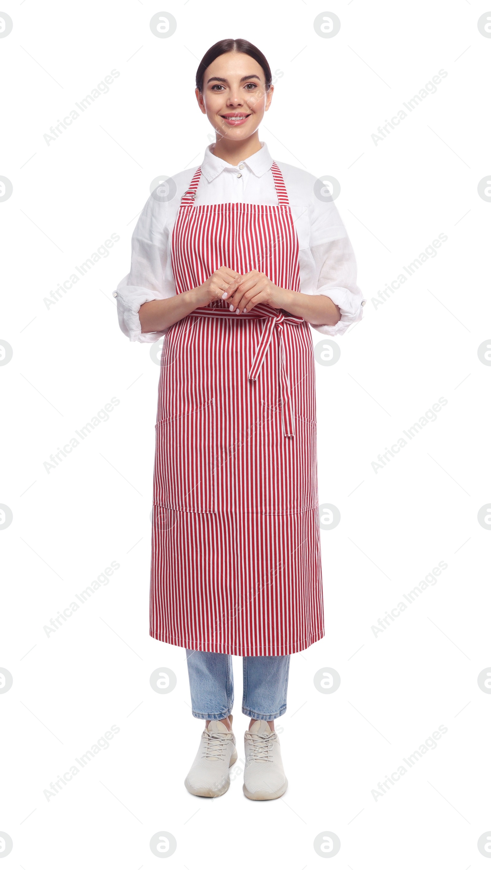 Photo of Young woman in red striped apron on white background