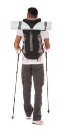 Photo of Male hiker with backpack and trekking poles on white background, back view