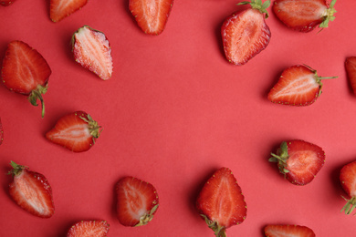 Tasty ripe strawberries on red background, flat lay. Space for text