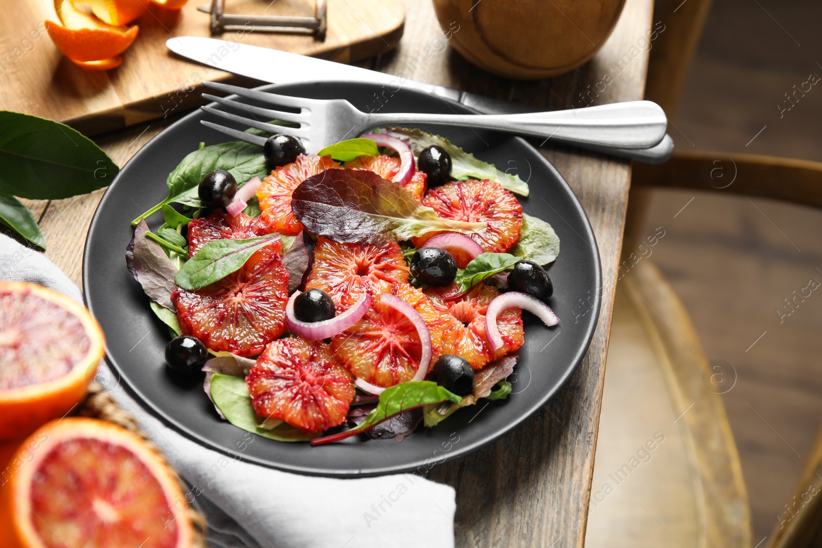 Photo of Delicious sicilian orange salad served on wooden table