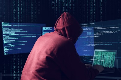 Image of Cyber attack. Anonymous hacker working with laptop and monitors on dark blue background. Binary code around him