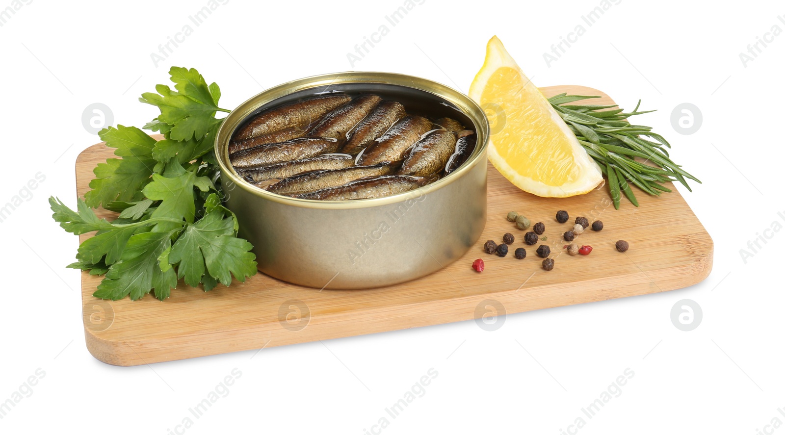 Photo of Board with canned sprats, herbs, peppercorns and slice of lemon isolated on white