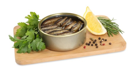 Board with canned sprats, herbs, peppercorns and slice of lemon isolated on white