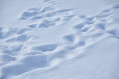 Photo of Beautiful snowdrift as background, closeup view. Winter weather