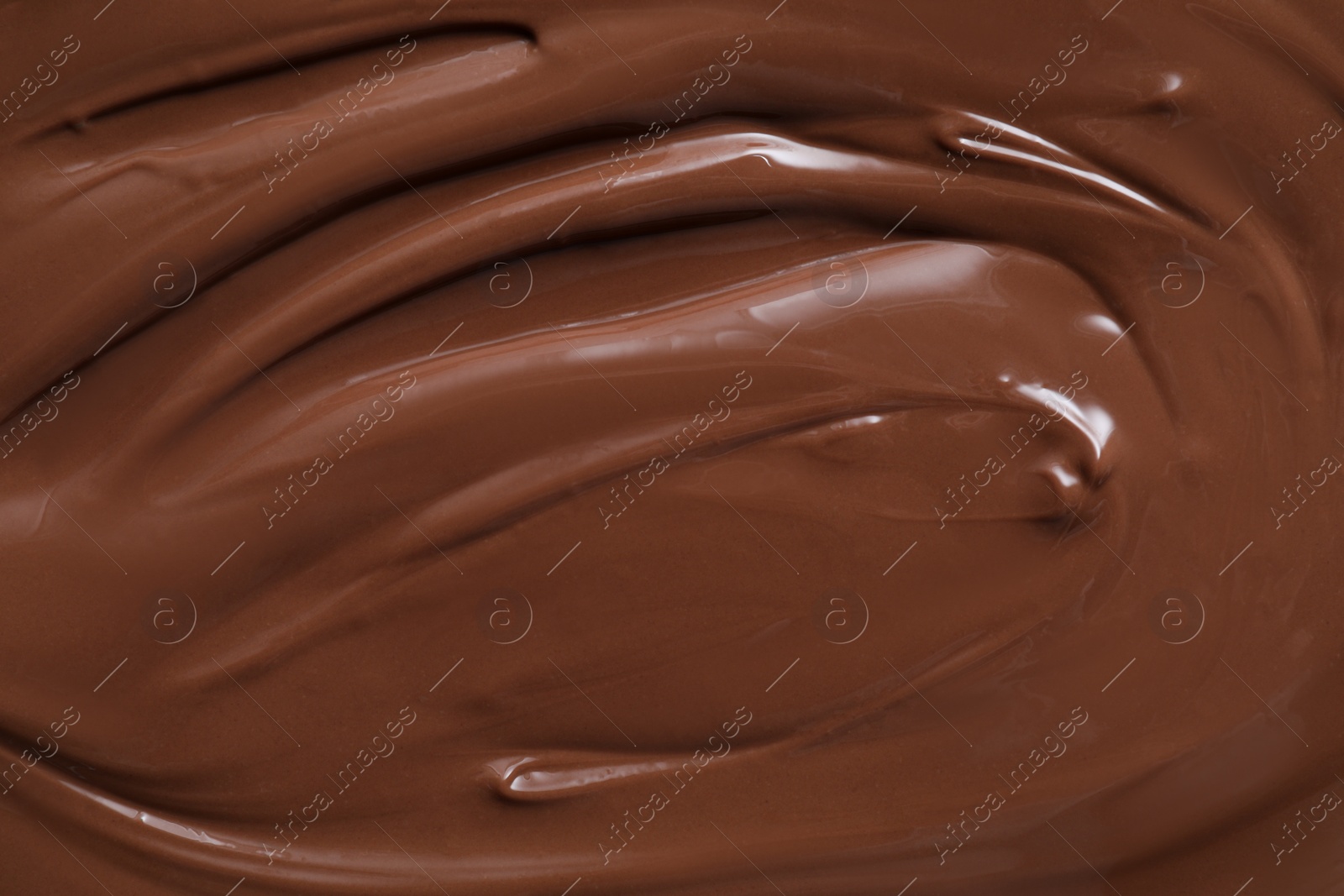 Photo of Tasty chocolate paste as background, closeup view