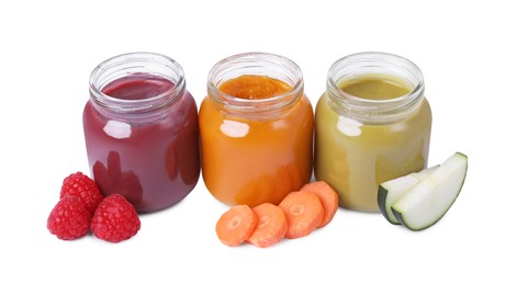 Photo of Jars of healthy baby food and ingredients isolated on white