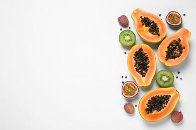 Photo of Fresh ripe papaya and other fruits on white background, top view