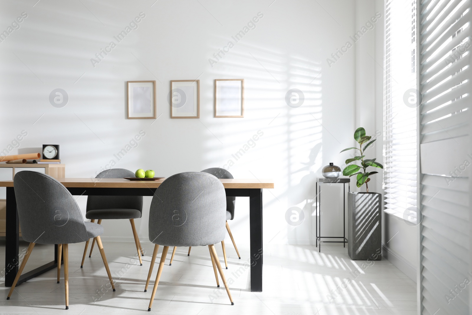 Photo of Stylish room interior with table and chairs. Idea for design