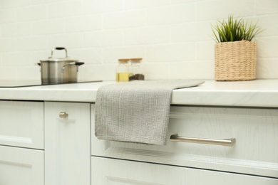 Photo of Cotton towel on countertop in modern kitchen