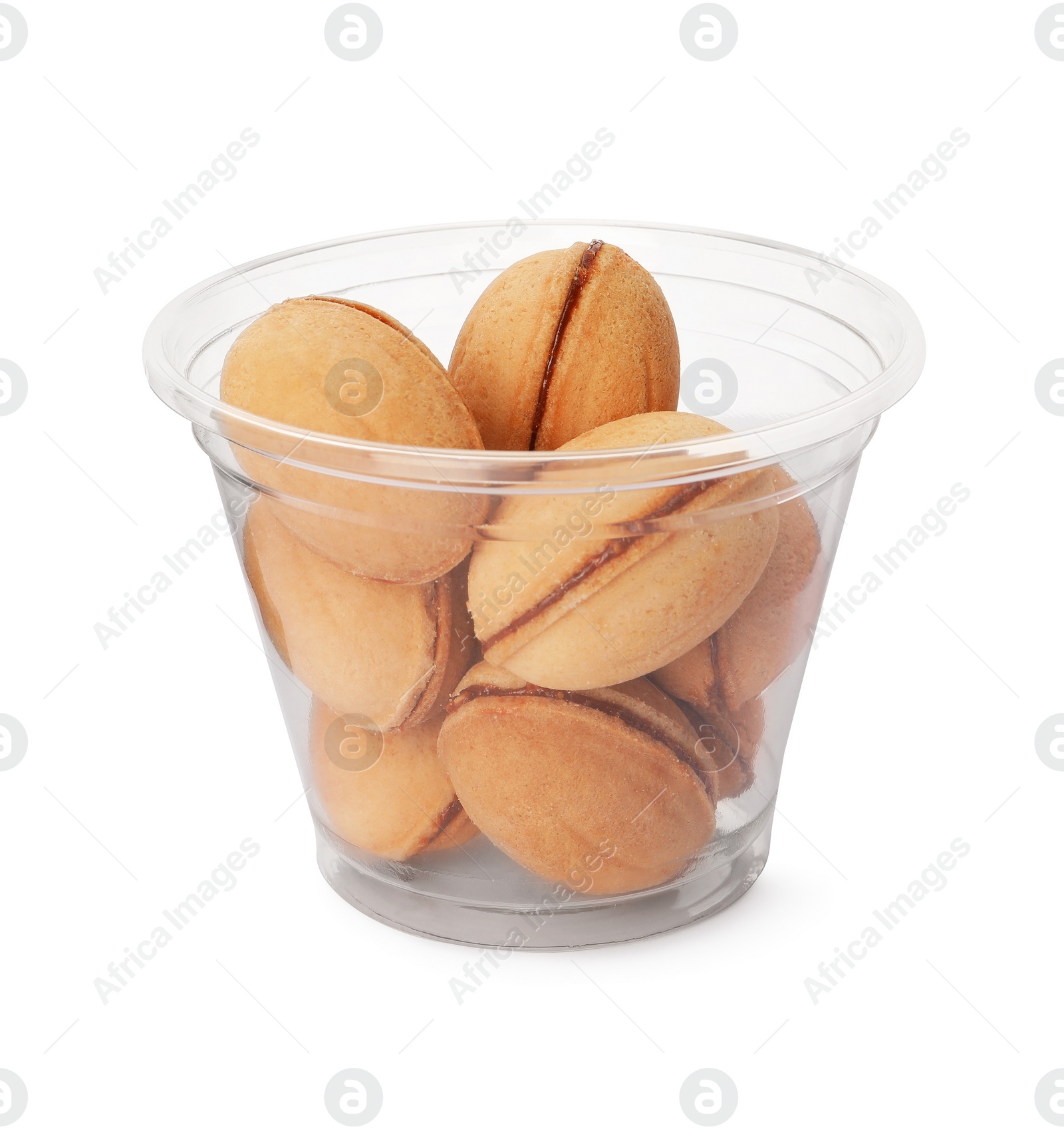 Photo of Delicious nut shaped cookies with boiled condensed milk in plastic up on white background