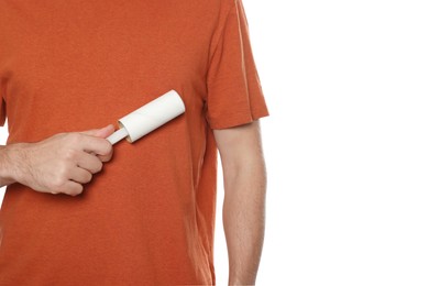 Man using lint roller on white background, closeup