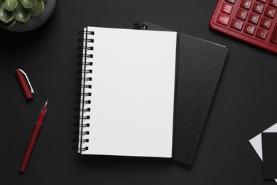 Photo of Flat lay composition with stylish notebooks on black background