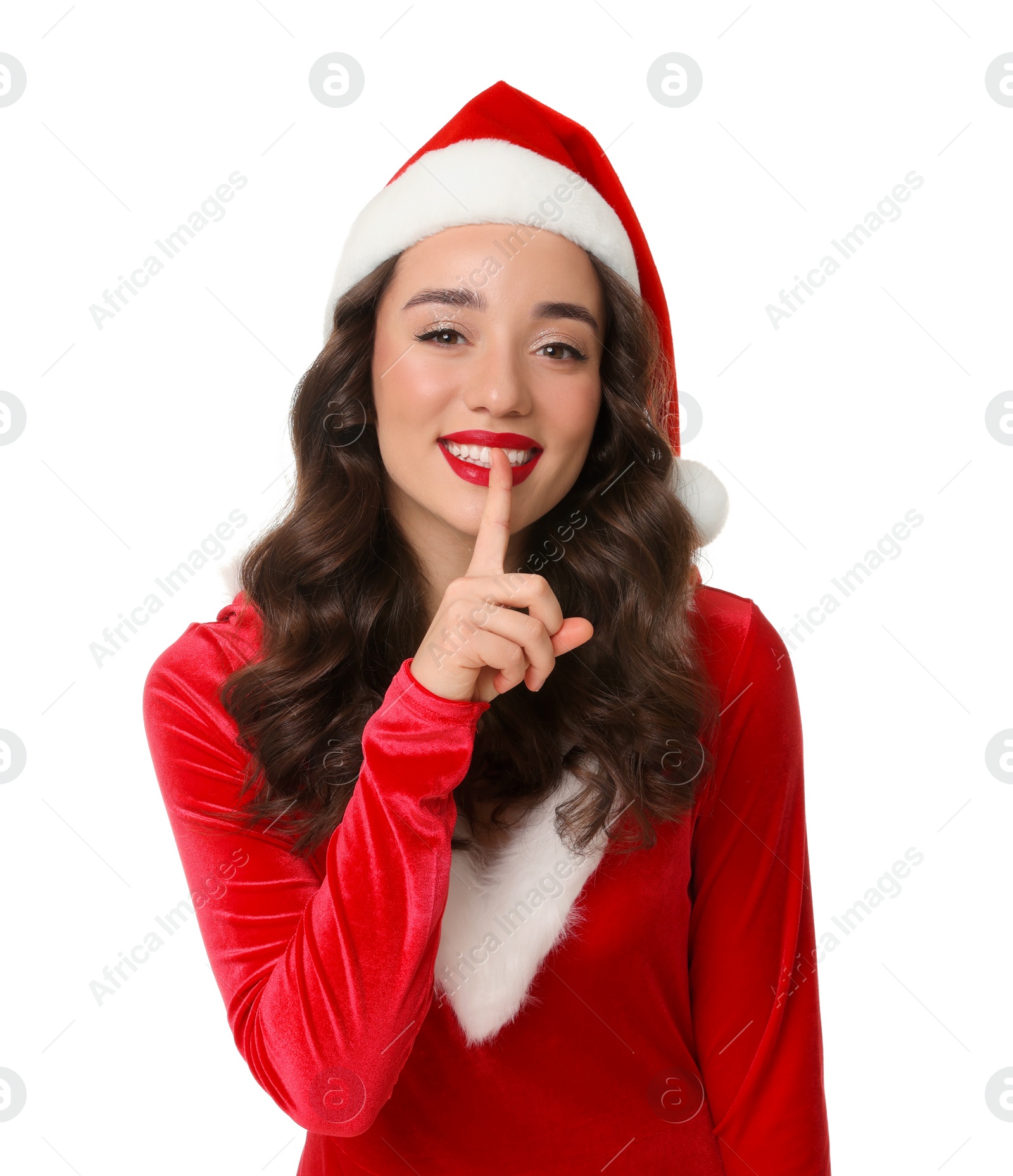 Photo of Beautiful young woman in Christmas red dress and Santa hat isolated on white