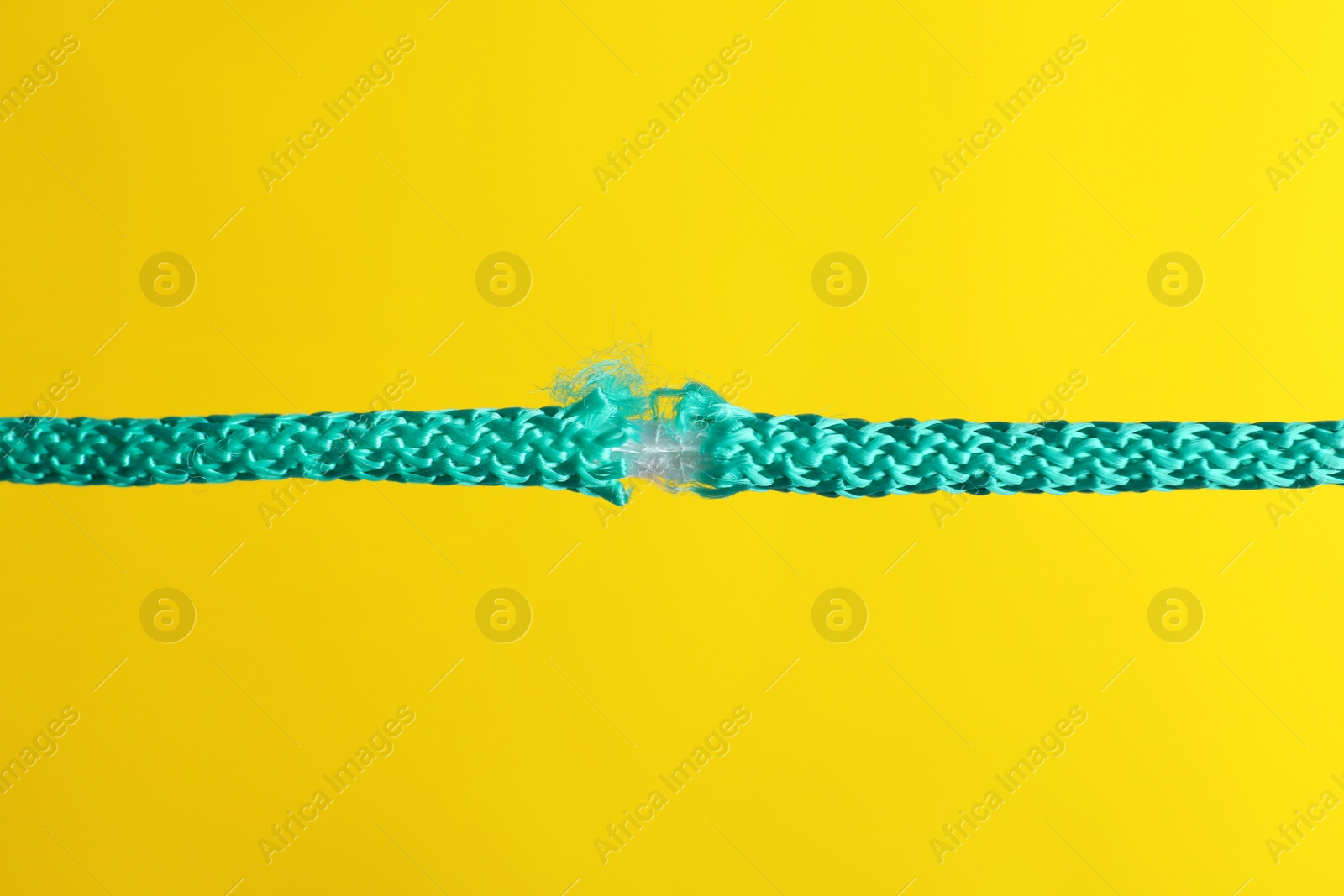 Photo of Rupture of blue rope on color background