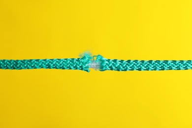 Photo of Rupture of blue rope on color background