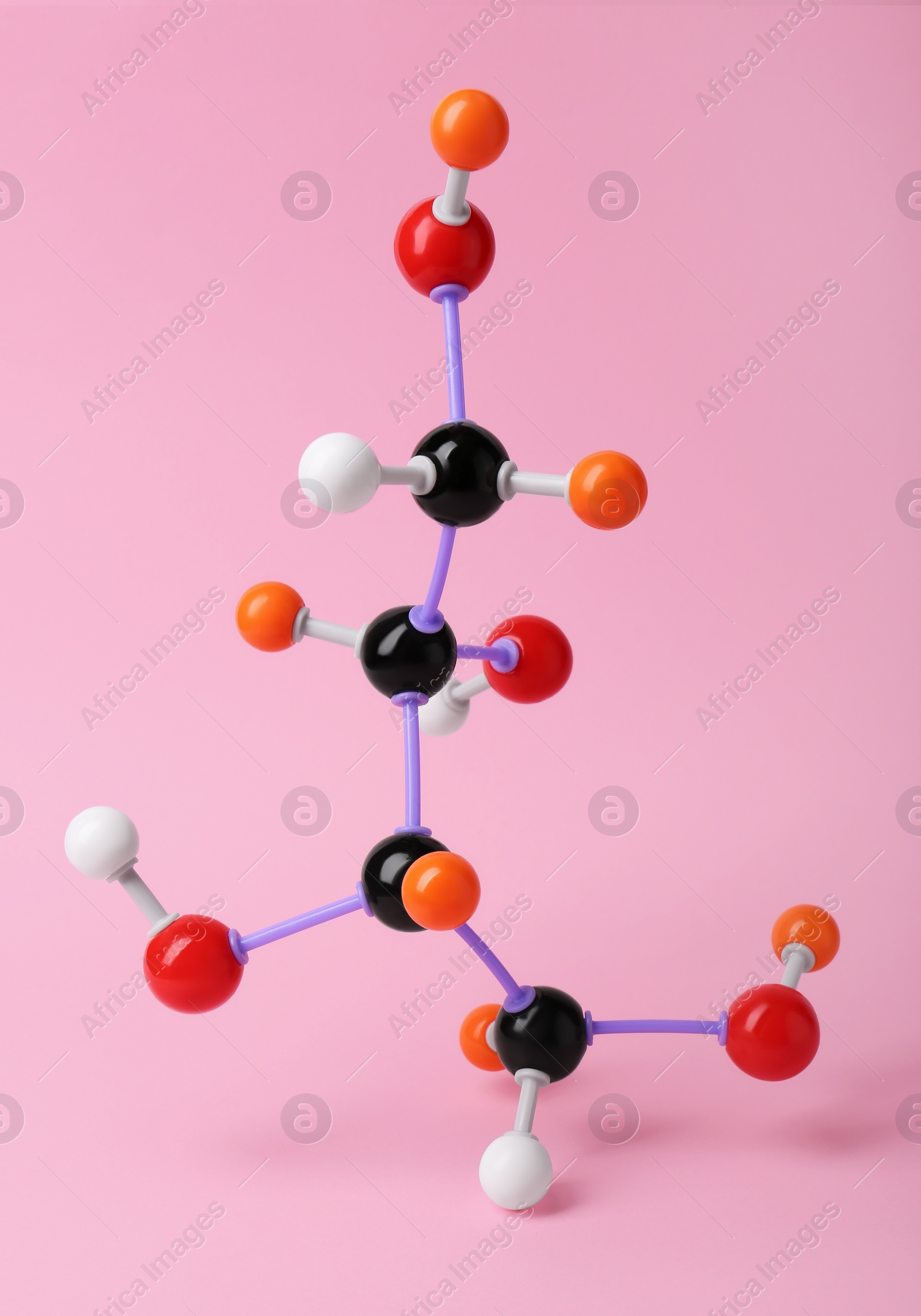 Photo of Molecule of sugar on pink background. Chemical model