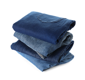 Photo of Stack of different jeans isolated on white