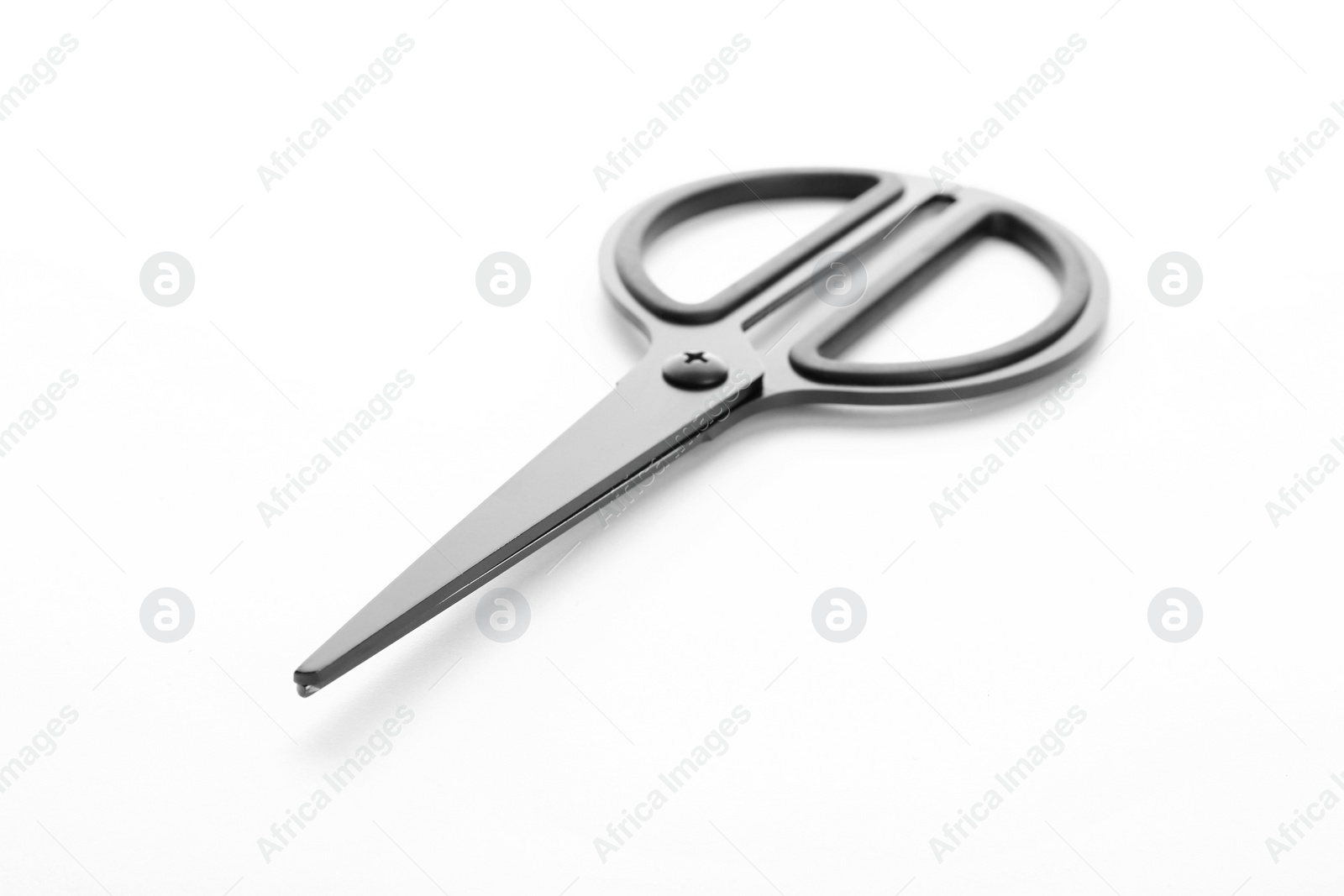 Photo of Pair of sharp scissors on white background