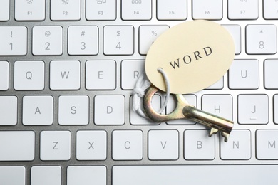 Photo of Key with tag WORD on computer keyboard, top view. Keyword concept