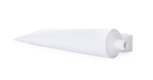 Photo of Blank tube of toothpaste isolated on white