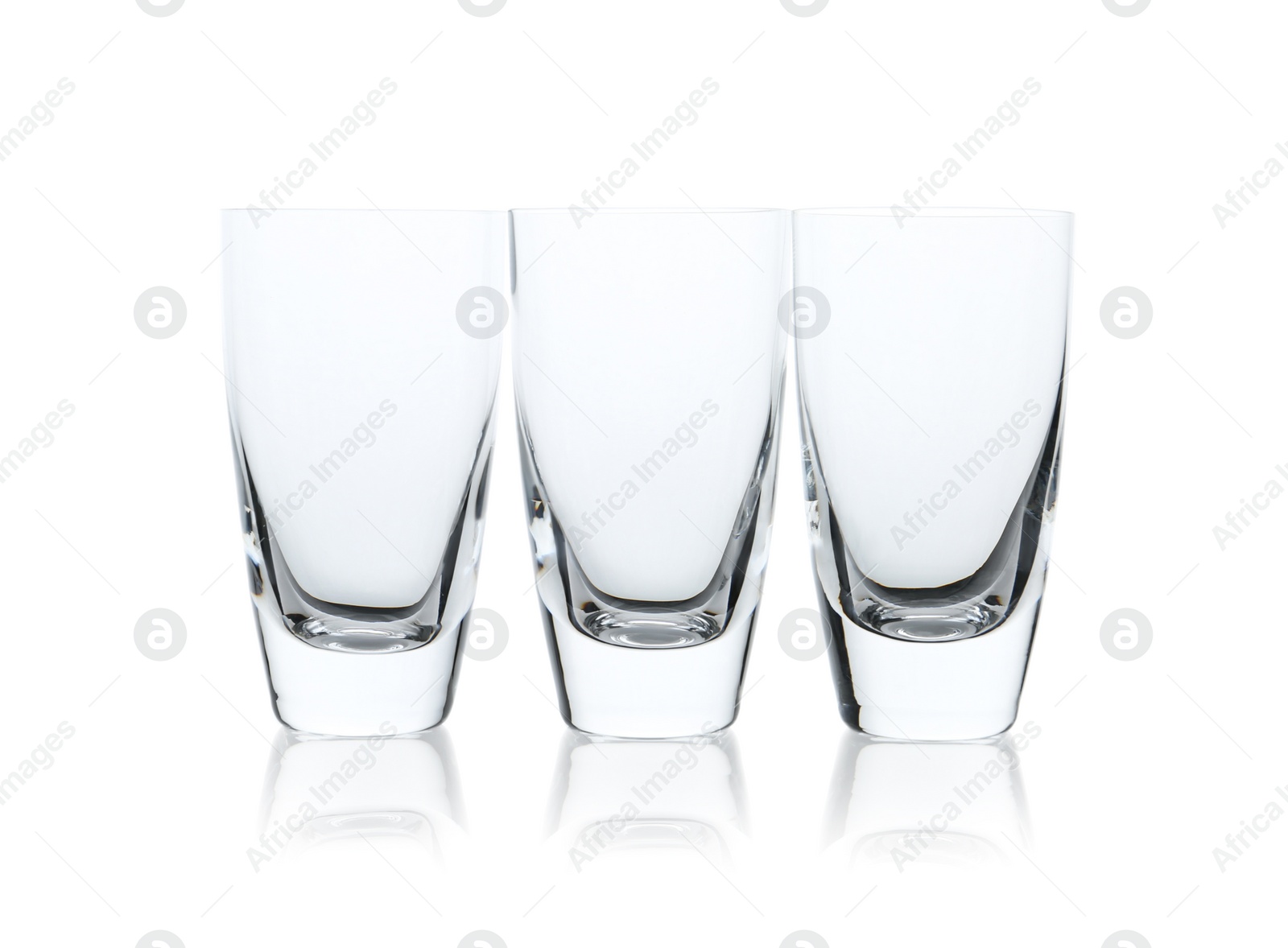 Photo of New clean empty glasses isolated on white