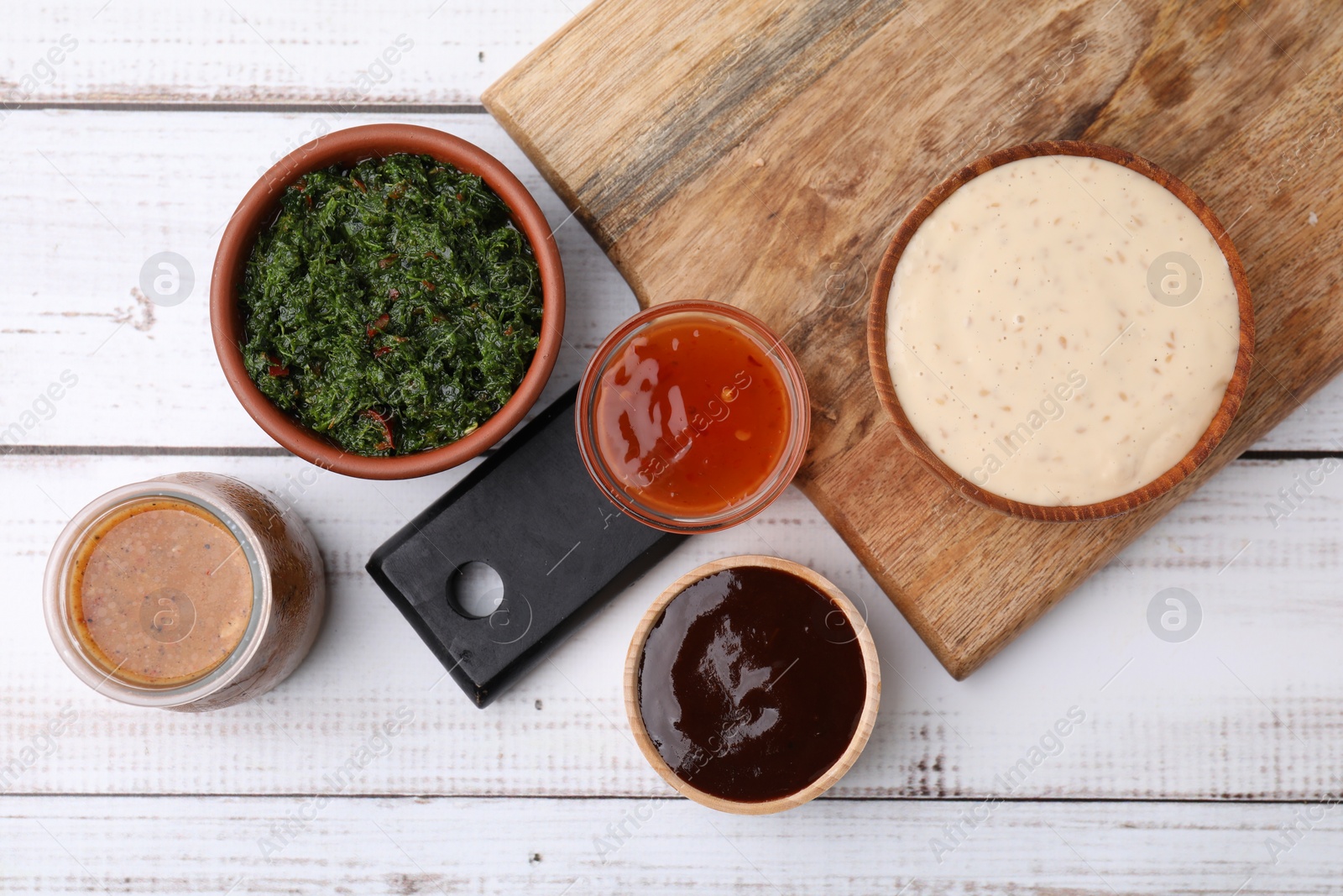 Photo of Different fresh marinades on white wooden table, flat lay