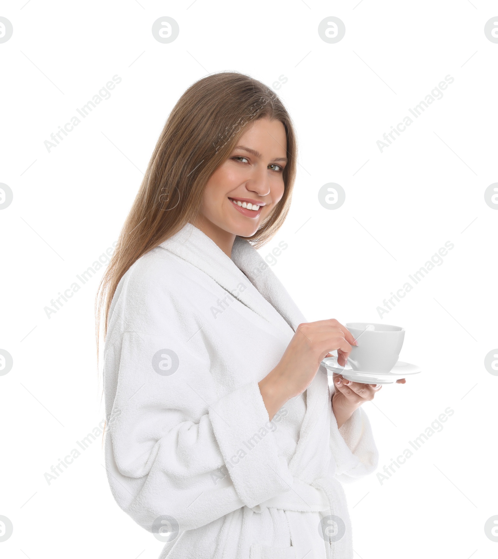 Photo of Young woman in bathrobe with cup of beverage on white background