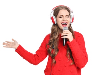 Photo of Happy young woman singing into microphone on white background. Christmas music