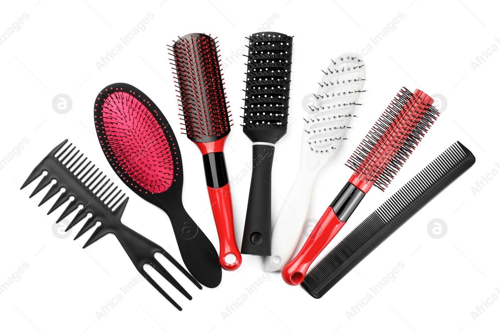 Photo of Set of hair brushes and combs isolated on white, top view