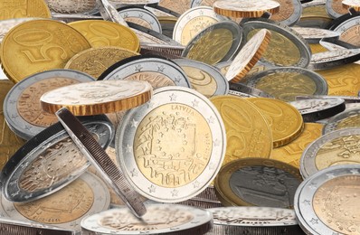 Many different euro cents and coins as background, closeup