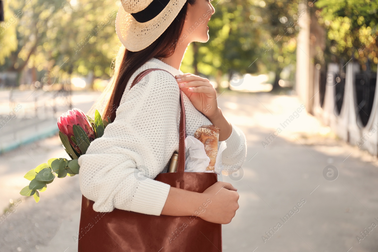 Photo of Woman with leather shopper bag outdoors, closeup