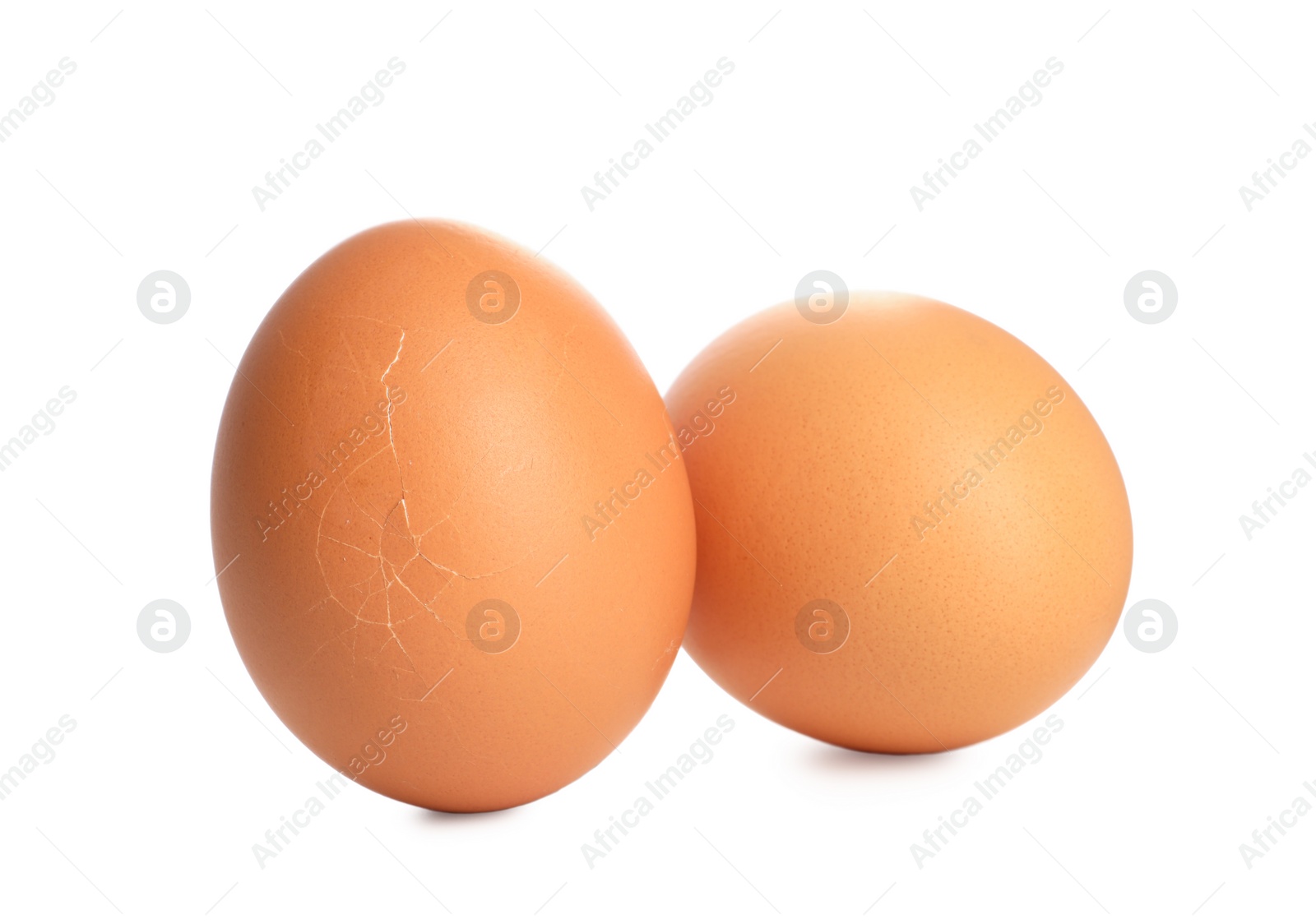 Photo of Two raw chicken eggs isolated on white