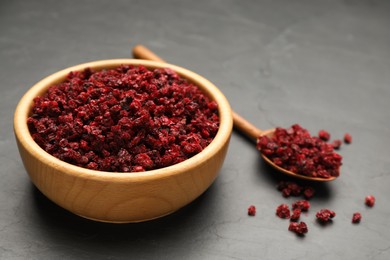 Dried red currant berries on black table