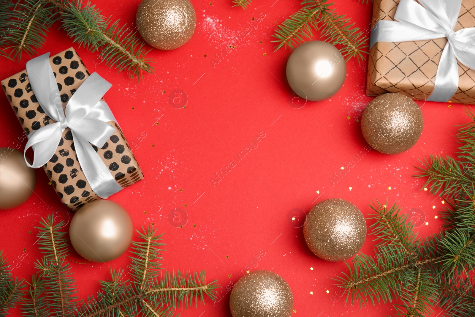 Photo of Flat lay composition with Christmas tree branches, festive decor and gift boxes on color background