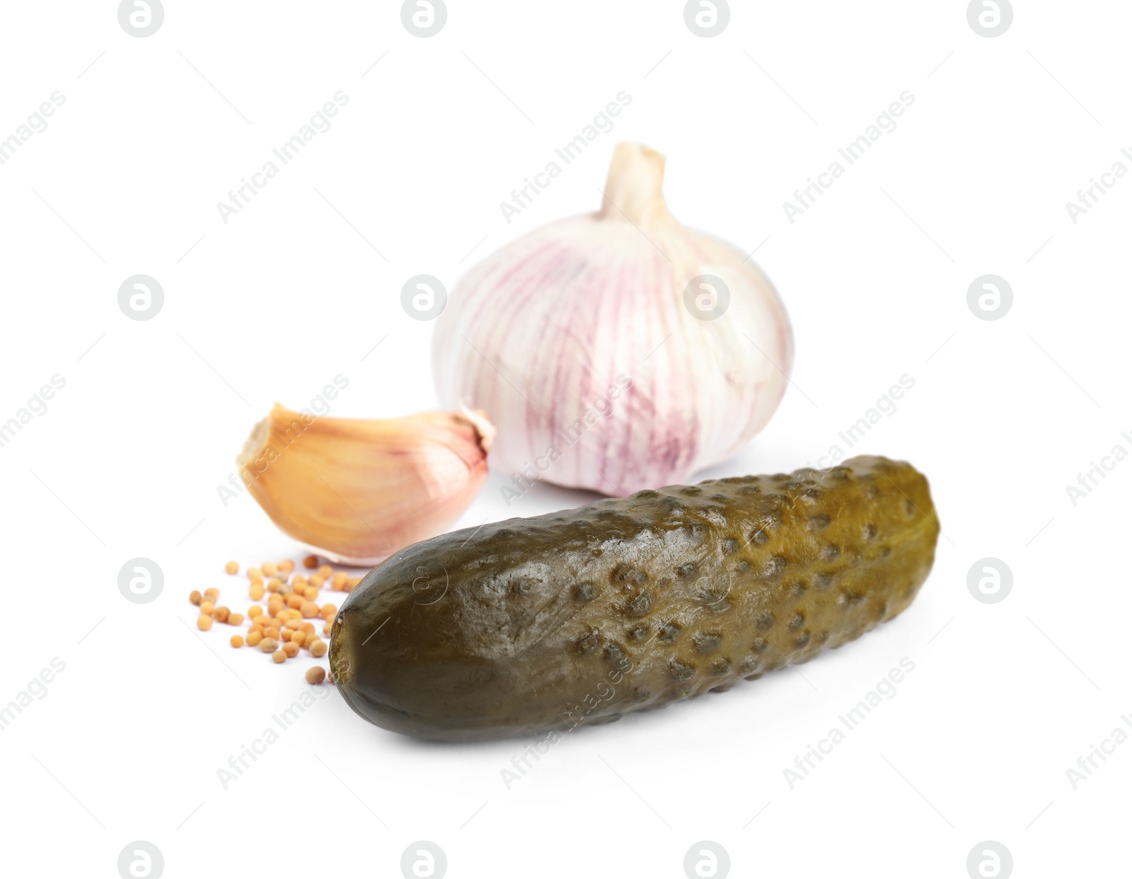 Photo of Pickled cucumber with products on white background