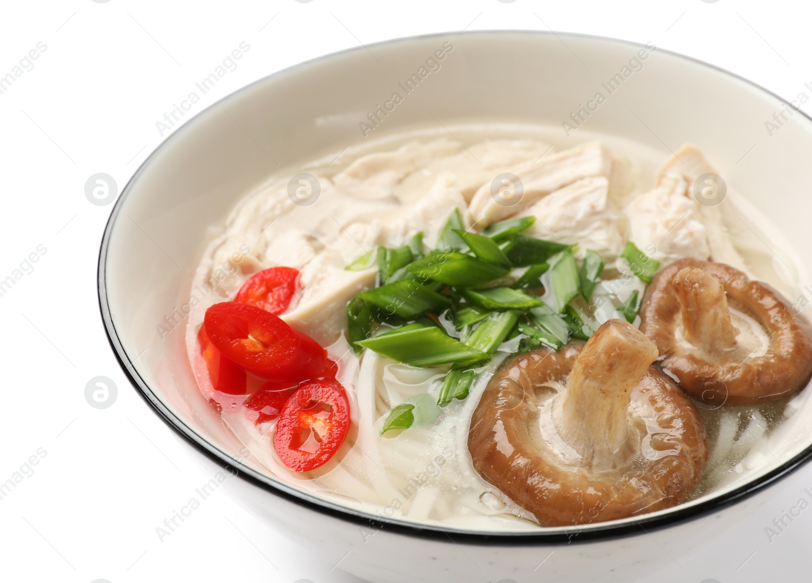 Photo of Delicious ramen with meat and mushrooms in bowl isolated on white. Noodle soup