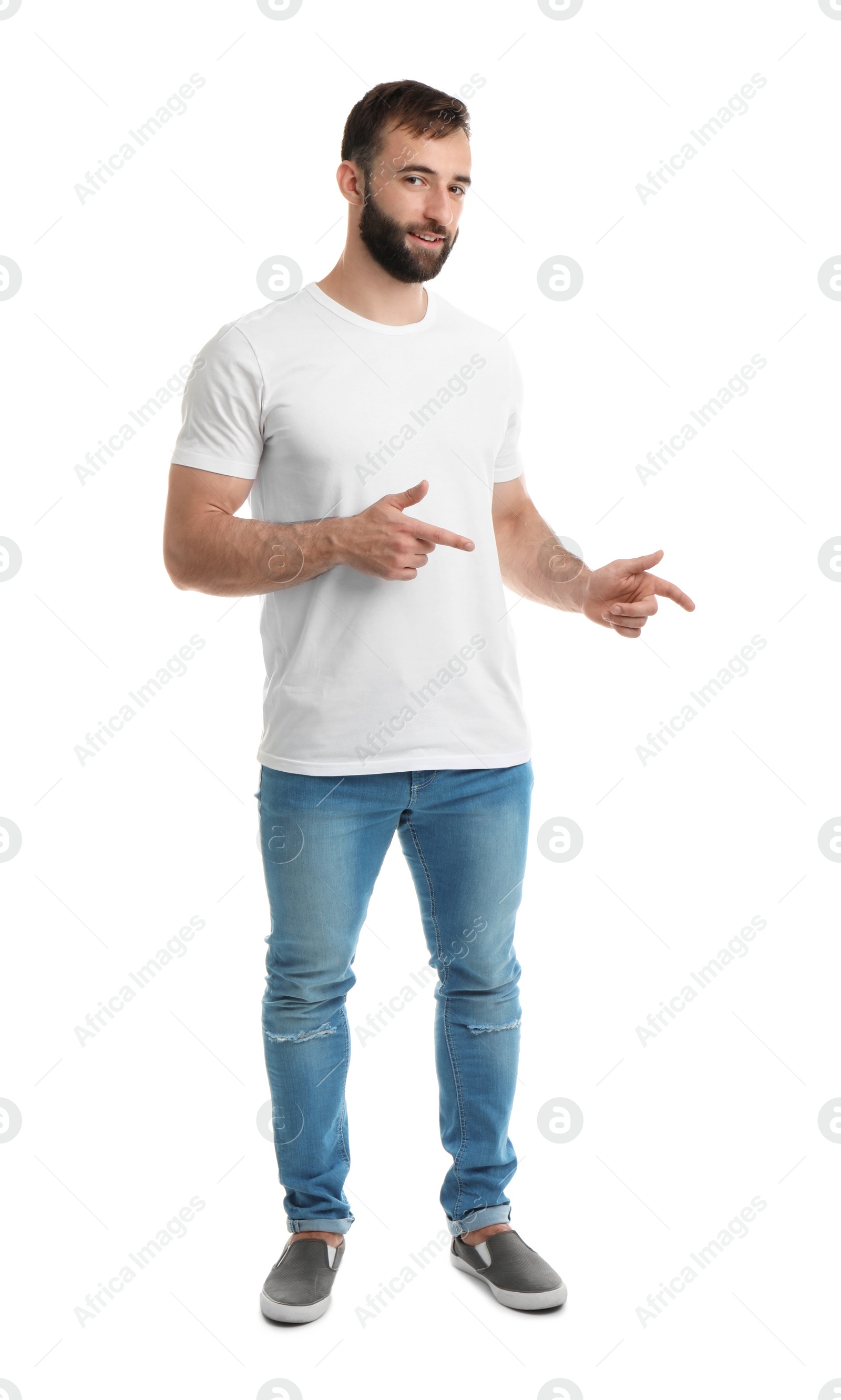 Photo of Young man in t-shirt on white background. Mockup for design