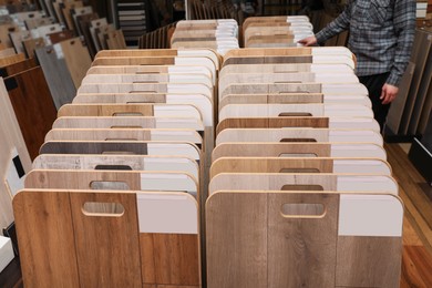 Photo of Many different samples of wooden flooring in store