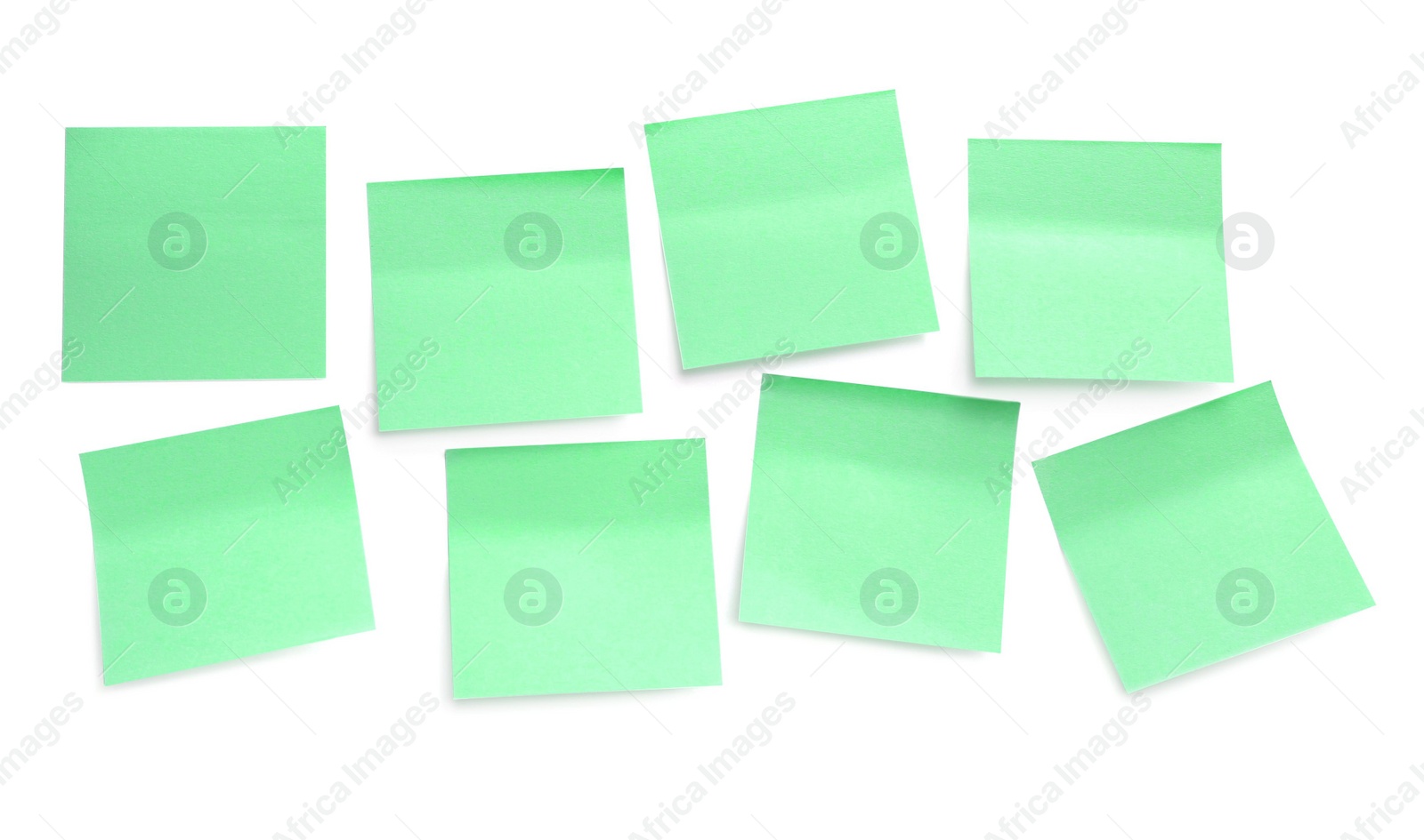 Photo of Blank pale yellow sticky notes on white background, top view. Space for text