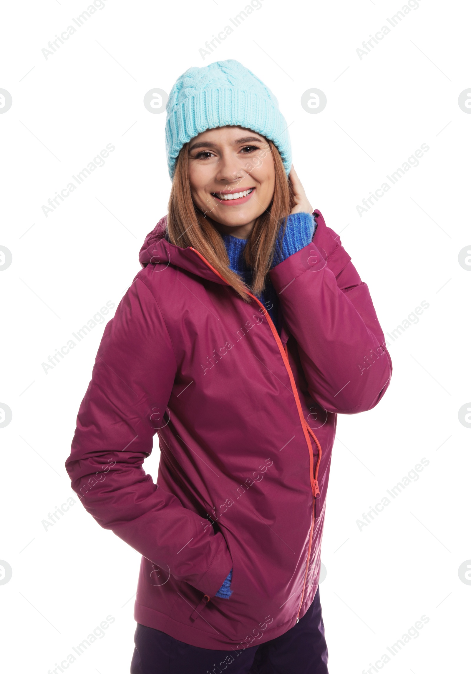 Photo of Young woman wearing warm clothes on white background. Ready for winter vacation