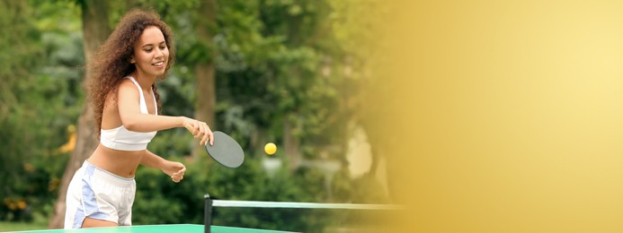 Image of Young African-American woman playing ping pong outdoors, space for text. Banner design