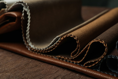 Different leather samples on table, closeup view