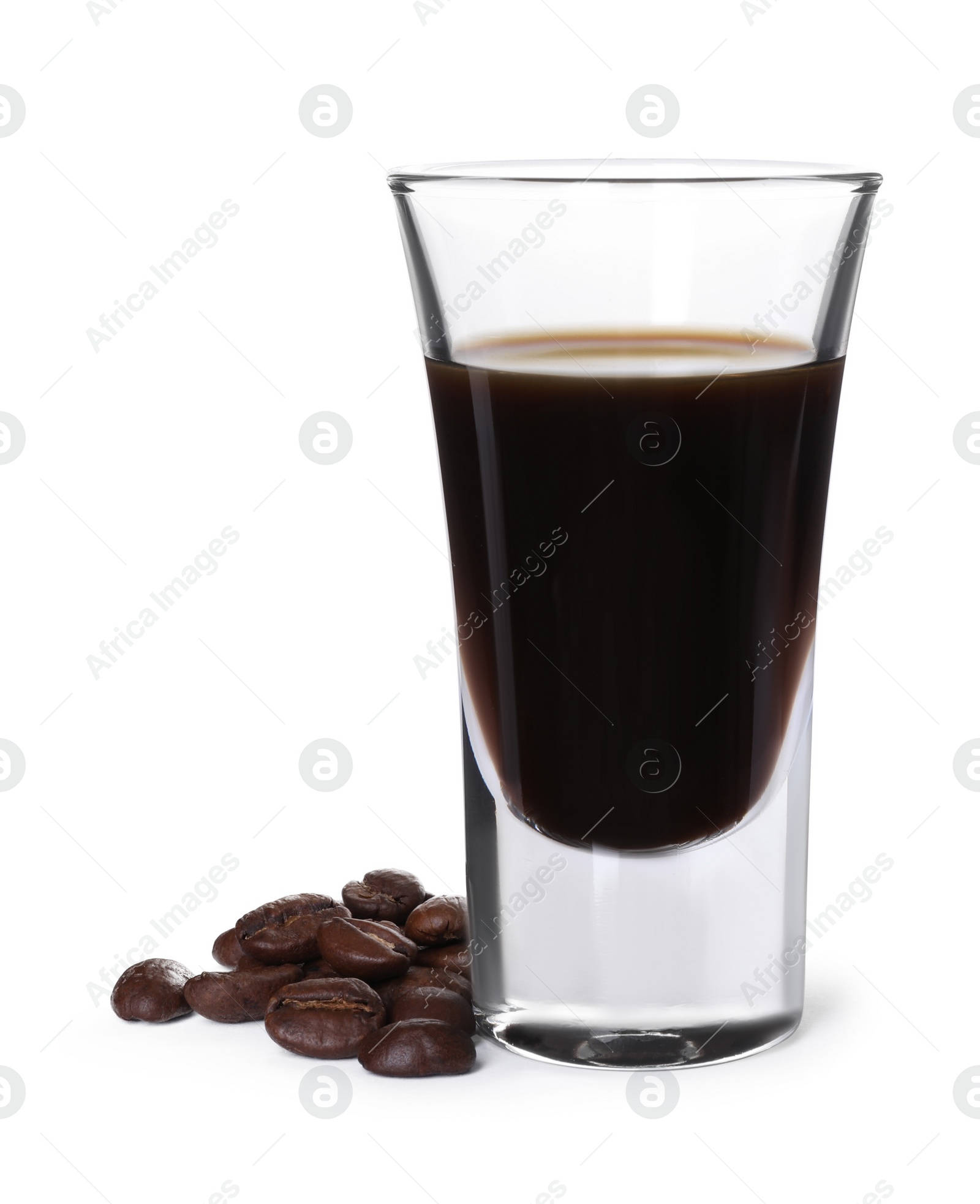 Photo of Shot glass with coffee liqueur and beans isolated on white