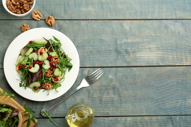 Delicious fresh celery salad served on light blue wooden table, flat lay. Space for text