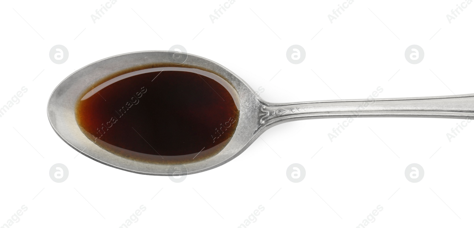 Photo of Tasty soy sauce in spoon isolated on white, top view