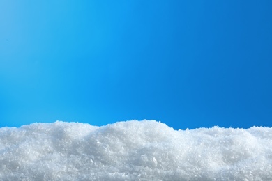 White snow drift on blue background. Winter weather