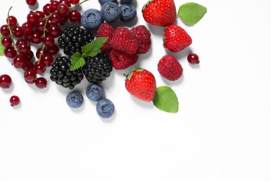 Photo of Many different fresh berries and mint leaves on white background, flat lay. Space for text