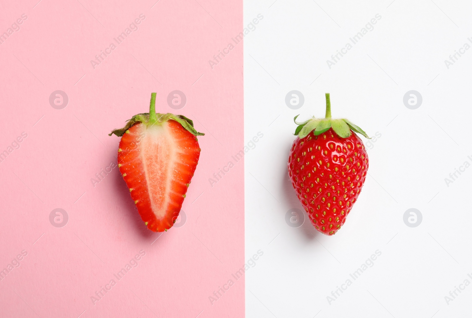 Photo of Flat lay composition with strawberries on color background